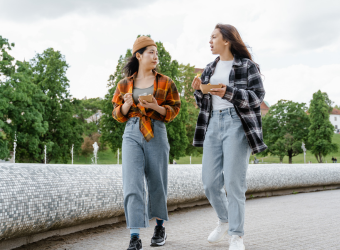 Two girls walking and talking